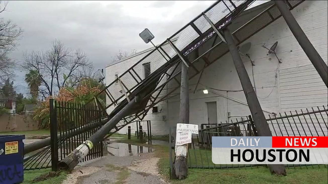 Pounding storms cause billboard to topple over onto pawn shop