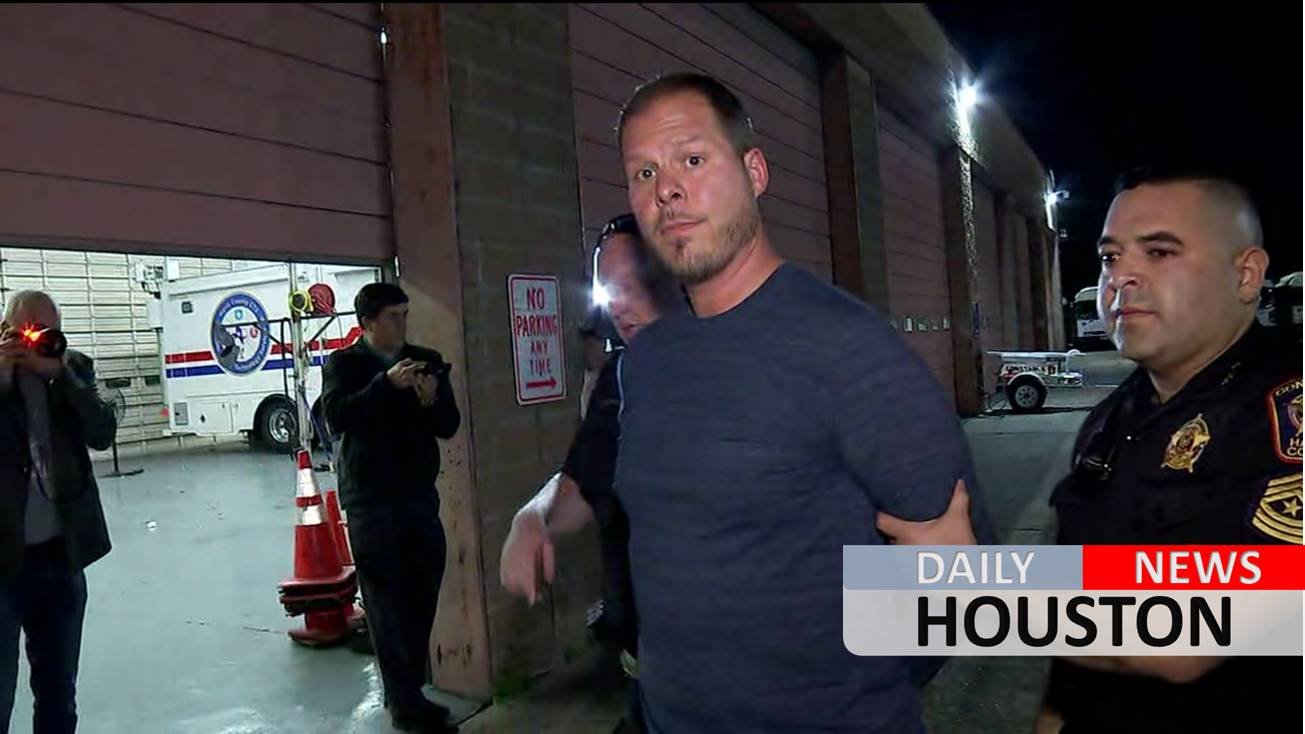 Man accused of trying to run over security guard in custody