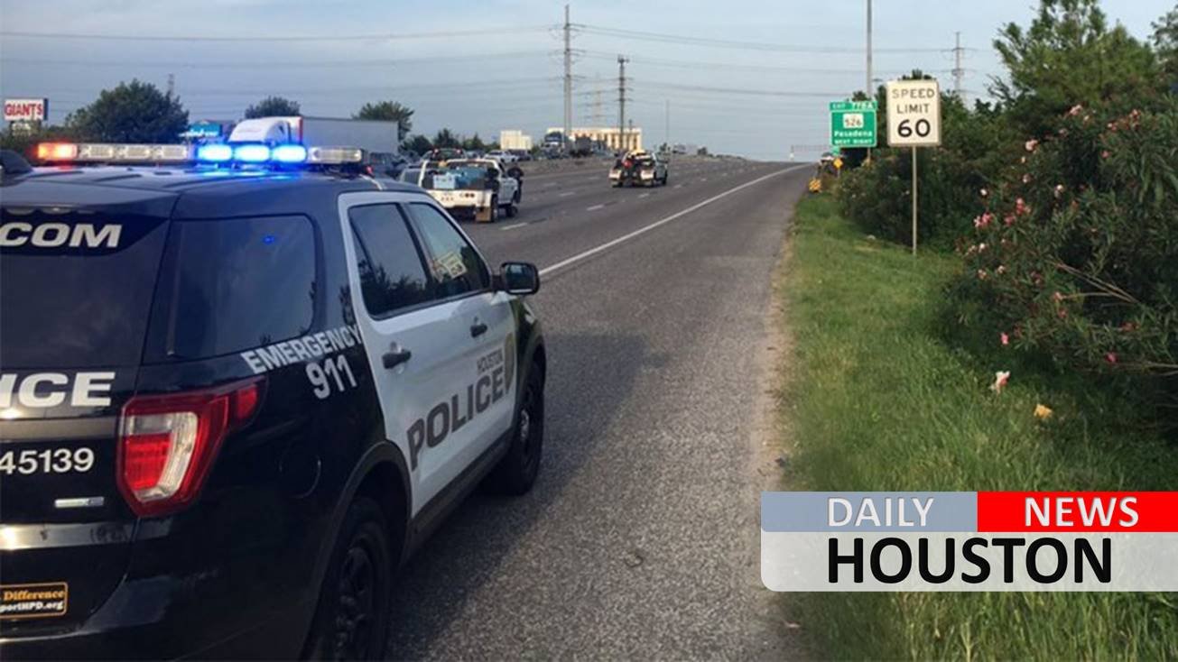 Suspect at large after shooting on Houston freeway during rush hour kills 2