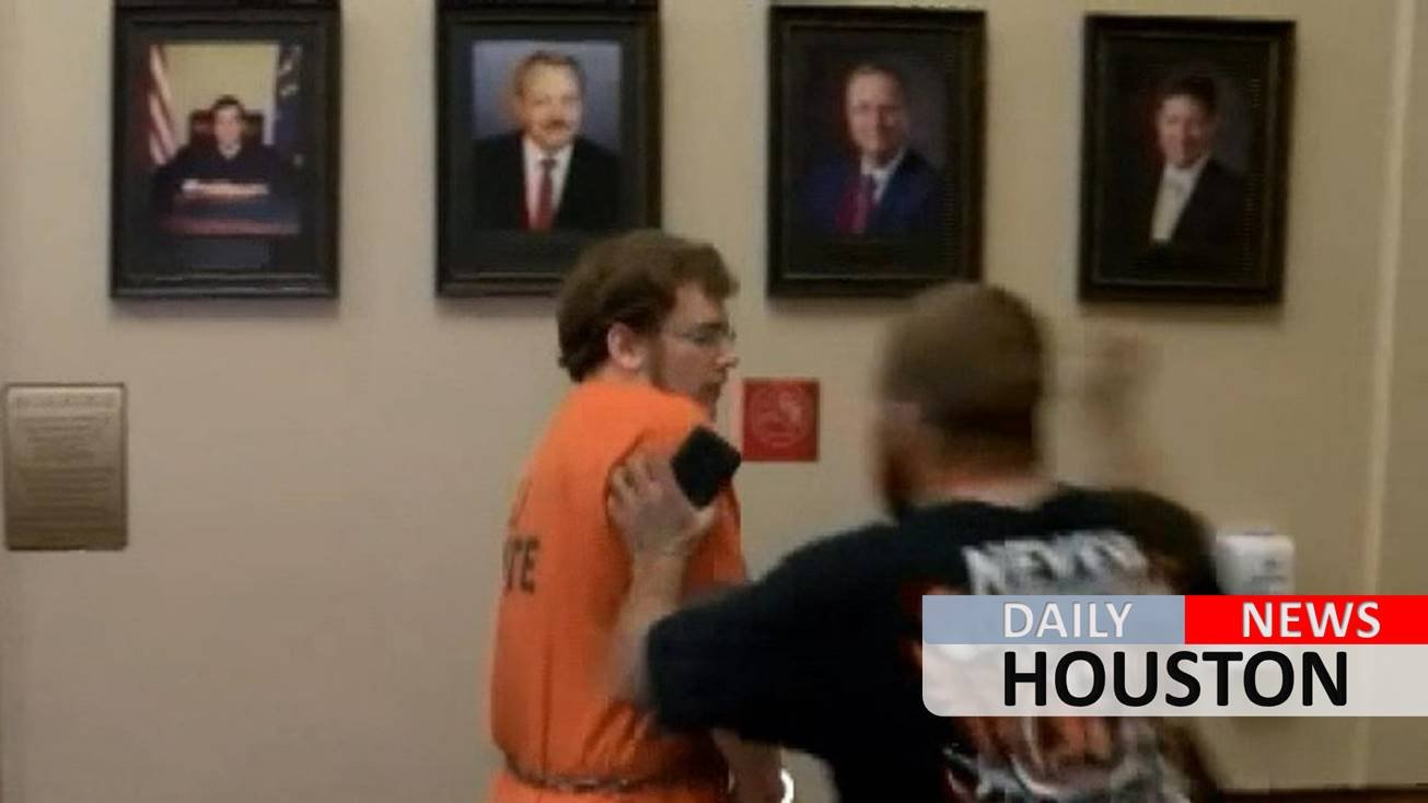 Indiana father convicted of killing 3-month-old son punched in the face in court