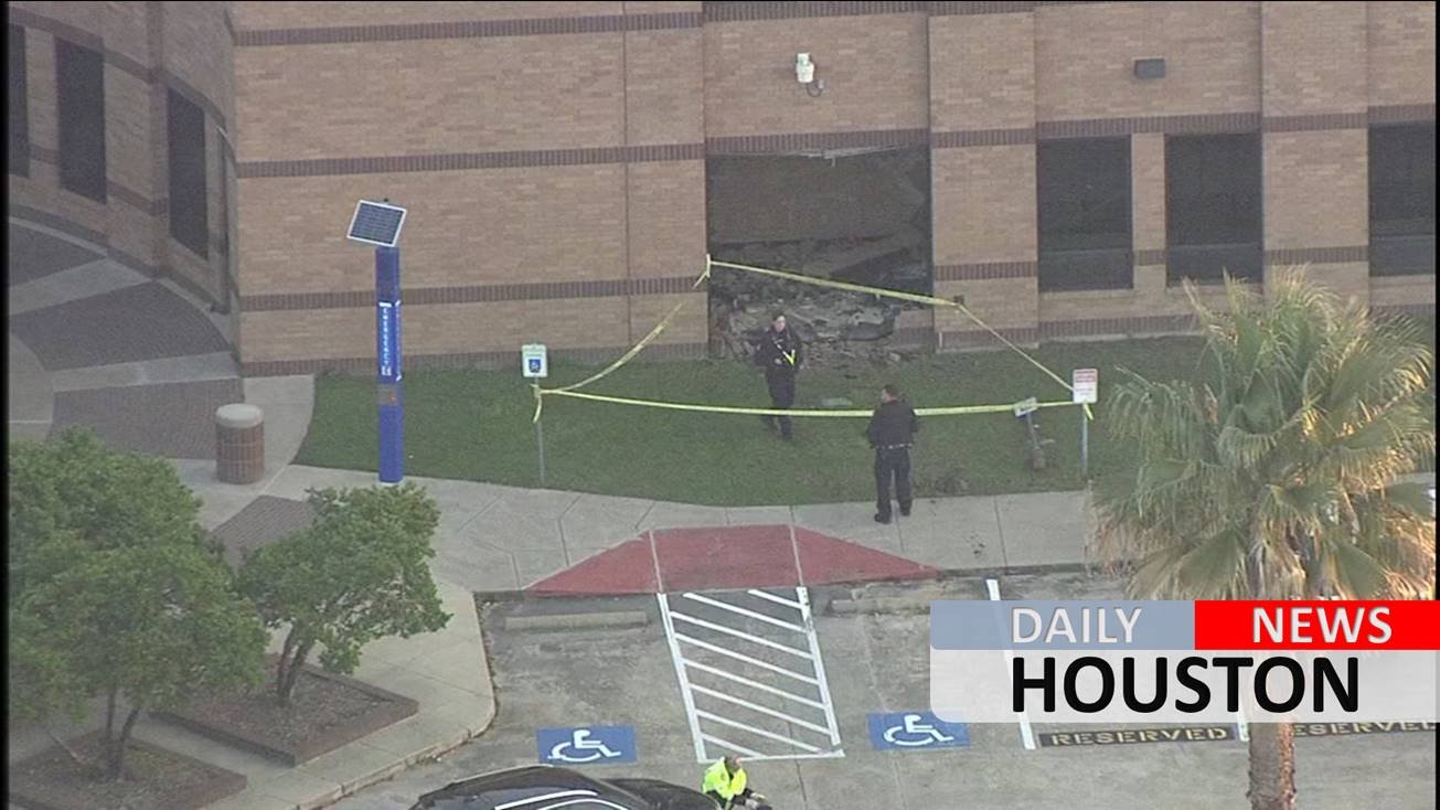 Cadillac smashes into building at Langham Creek High School